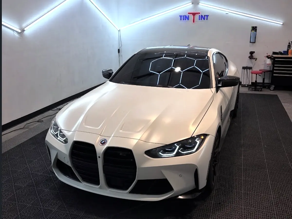 White BMW in the clean TinTinT installation studio