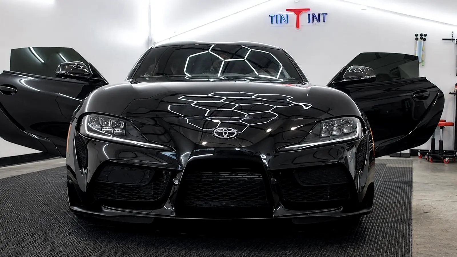 Black Toyota Supra inside the TinTinT installation studio