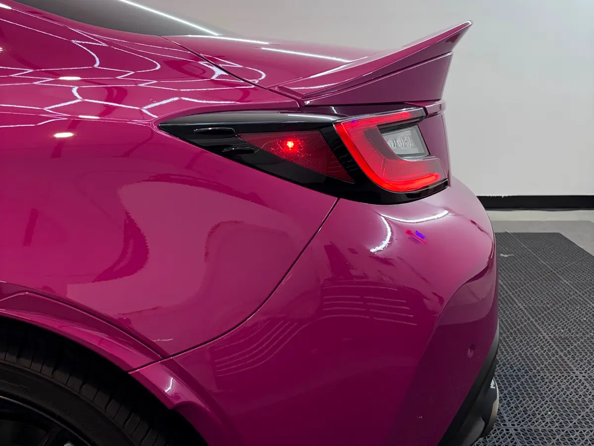 Rear quarter detail of pink Subaru BRZ full wrap