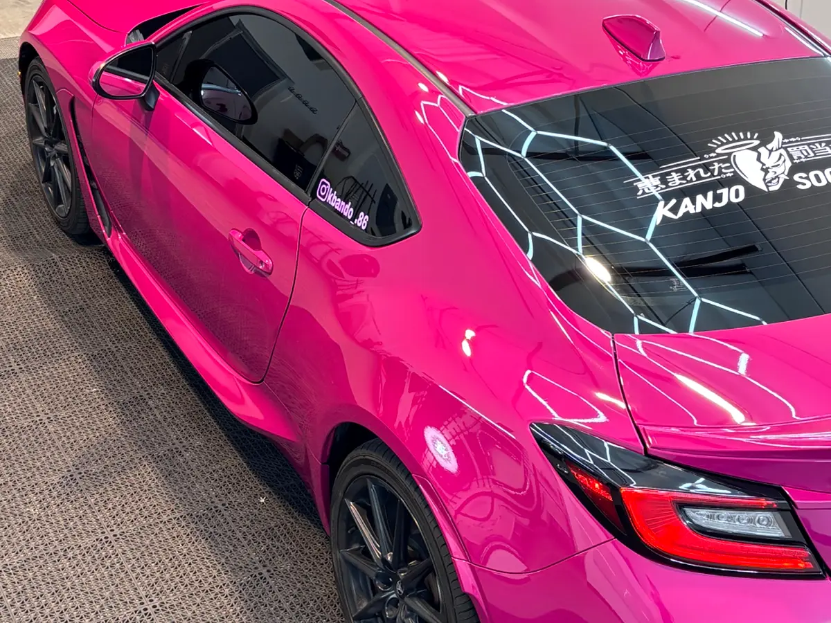 Rear view of pink Subaru BRZ full wrap